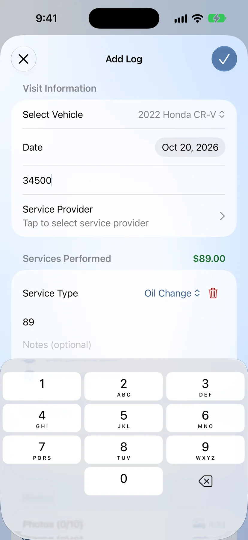GreaseNote iPhone app add log screen for recording an oil change, with vehicle, date, mileage and cost